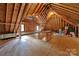 Unfinished attic space offers potential for storage or customization at 8524 Quarters Ln, Mint Hill, NC 28227