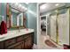 Bathroom with vanity, mirror, and walk-in shower at 8524 Quarters Ln, Mint Hill, NC 28227