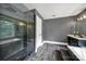 Modern bathroom showcasing a glass-enclosed shower, separate tub, dual sinks, and sleek finishes at 8524 Quarters Ln, Mint Hill, NC 28227