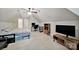 Spacious bedroom with ceiling fan, desk, TV, and storage underneath bed at 8524 Quarters Ln, Mint Hill, NC 28227