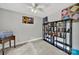 Bedroom showcases a ceiling fan, built-in bookcase, and neutral carpet creating a cozy and functional space at 8524 Quarters Ln, Mint Hill, NC 28227