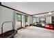 Large bonus room with wood floors and ample natural light from the window at 8524 Quarters Ln, Mint Hill, NC 28227