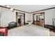 Spacious bonus room with neutral carpet, perfect for recreation or relaxation at 8524 Quarters Ln, Mint Hill, NC 28227