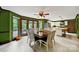 Bright dining area adjacent to the kitchen, with large windows offering views of the backyard at 8524 Quarters Ln, Mint Hill, NC 28227