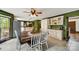 Eat-in kitchen and dining area with white cabinetry, granite counters, and stainless appliances at 8524 Quarters Ln, Mint Hill, NC 28227