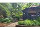 Landscaped gardens with flowers, a stone path and a gazebo at 8524 Quarters Ln, Mint Hill, NC 28227