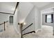 Upstairs hallway showing the staircase and access to bedrooms at 8524 Quarters Ln, Mint Hill, NC 28227