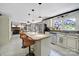 Spacious kitchen with a large island, granite countertops, stainless steel appliances, and a view to the living area at 8524 Quarters Ln, Mint Hill, NC 28227