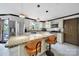Kitchen features granite counters, stainless steel appliances, island with seating and a window at 8524 Quarters Ln, Mint Hill, NC 28227