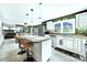 Modern kitchen with granite countertops, stainless steel appliances and a breakfast bar area at 8524 Quarters Ln, Mint Hill, NC 28227