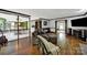 Inviting living room with hardwood floors and comfortable seating, open to the kitchen at 8524 Quarters Ln, Mint Hill, NC 28227