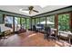 Bright sunroom with large windows, a ceiling fan, and space for multiple desks or seating areas at 8524 Quarters Ln, Mint Hill, NC 28227