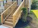New wooden stairs leading up to a cozy home entrance with landscaped garden at 953 Hardin Dr, Shelby, NC 28150