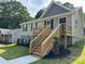 Charming home with a welcoming wooden staircase and lovely landscaping enhancing the curb appeal at 953 Hardin Dr, Shelby, NC 28150