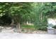 Beautiful backyard with fire pit and a shed at 9814 Fernspray Rd, Charlotte, NC 28215