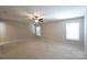Spacious bedroom with neutral colors, ceiling fan and lots of natural light at 9814 Fernspray Rd, Charlotte, NC 28215