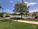 Beautiful fenced community pool with pergolas, lush landscaping, and walking path, perfect for relaxation at 9814 Fernspray Rd, Charlotte, NC 28215
