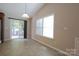 Bright dining area with sliding glass doors leading to a patio, perfect for indoor-outdoor living at 9814 Fernspray Rd, Charlotte, NC 28215