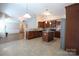 Well-lit kitchen featuring stainless steel appliances, a center island, and adjacent dining area at 9814 Fernspray Rd, Charlotte, NC 28215