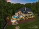 Night aerial view of a large backyard with an in-ground pool, landscaped grounds, firepit, and cozy lighting throughout at 10170 Enclave Cir, Concord, NC 28027