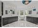 Luxurious bathroom with dual vanities, freestanding tub, and large windows offering natural light at 10170 Enclave Cir, Concord, NC 28027