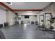 Spacious home gym with weightlifting equipment, mirrors, and rubber flooring for workouts at 10170 Enclave Cir, Concord, NC 28027