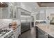 This gourmet kitchen features stainless steel appliances, granite countertops, and custom cabinets at 10170 Enclave Cir, Concord, NC 28027