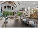 Open-concept living area featuring a wet bar, vaulted ceilings, and lots of natural light at 10170 Enclave Cir, Concord, NC 28027