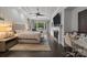 Bright primary bedroom features a fireplace, seating area, and a ceiling fan at 10170 Enclave Cir, Concord, NC 28027