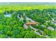 A high angle aerial view of a neighborhood with mature trees, the home is labelled 10327 Oak Pond Cir at 10327 Oak Pond Cir, Charlotte, NC 28277