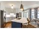 Spacious kitchen with stainless appliances, a center island, and an adjacent breakfast area, perfect for Gathering gatherings at 10327 Oak Pond Cir, Charlotte, NC 28277