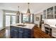Gourmet kitchen with a center island, white countertops, and breakfast bar, offering ample space for cooking and dining at 10327 Oak Pond Cir, Charlotte, NC 28277