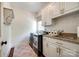 Well-equipped laundry room with modern appliances, custom cabinets, and a stylish countertop for folding and organizing at 10327 Oak Pond Cir, Charlotte, NC 28277