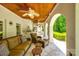 Inviting outdoor living area with wicker furniture and an outdoor kitchen, perfect for entertaining at 10327 Oak Pond Cir, Charlotte, NC 28277