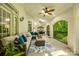 Spacious covered patio with ample seating and views of the lush greenery, perfect for relaxation at 10327 Oak Pond Cir, Charlotte, NC 28277