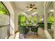 Relaxing screened-in patio with comfortable seating and views of the lush green surroundings at 10327 Oak Pond Cir, Charlotte, NC 28277