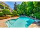 Gorgeous pool with well-maintained landscaping, providing a relaxing outdoor oasis at 10327 Oak Pond Cir, Charlotte, NC 28277