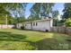 Spacious backyard offers a privacy fence and green grass perfect for entertaining and play at 104 Berry St, Fort Mill, SC 29715