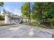 Charming single-story home with a covered front porch and long driveway at 104 Berry St, Fort Mill, SC 29715