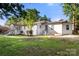 Traditional white brick single-Gathering home with a porch and well-maintained lawn, offering classic curb appeal at 104 Berry St, Fort Mill, SC 29715