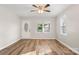 Bright living room with wood floors, a front door, and plenty of natural light at 104 Berry St, Fort Mill, SC 29715