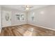 Bright living room with wood floors, a front door, and plenty of natural light at 104 Berry St, Fort Mill, SC 29715