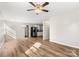 Inviting living area with hardwood floors, neutral paint, and modern lighting fixtures at 104 Berry St, Fort Mill, SC 29715
