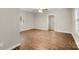 Spacious living room with beautiful hardwood flooring and natural light from multiple windows at 104 Berry St, Fort Mill, SC 29715