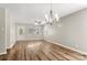 Open-concept living and dining area with hardwood floors and modern lighting at 104 Berry St, Fort Mill, SC 29715