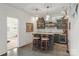 Entertaining wet bar area with gray cabinets, stone countertop, and pendant lighting at 11000 Strike The Gold Ln, Waxhaw, NC 28173
