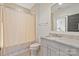 Light-filled bathroom featuring a vanity with granite countertop and a shower with neutral-toned curtain at 11000 Strike The Gold Ln, Waxhaw, NC 28173