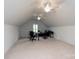 Versatile bonus room with a ceiling fan, neutral carpet, and potential for a home office or entertainment area at 11000 Strike The Gold Ln, Waxhaw, NC 28173