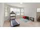Bright exercise room with large windows, carpeted floors, and modern equipment at 11000 Strike The Gold Ln, Waxhaw, NC 28173