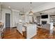 Spacious kitchen with granite island, stainless steel appliances, and seamless transition to the cozy living room at 11000 Strike The Gold Ln, Waxhaw, NC 28173